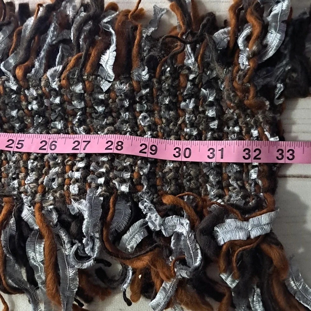Eyeful Fringe Knit Scarf in Brown And Silver Has Faux Feather Detail